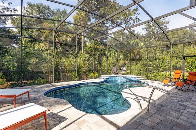 view of swimming pool with a patio and glass enclosure