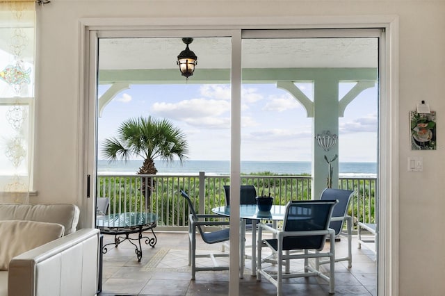 sunroom / solarium with a water view