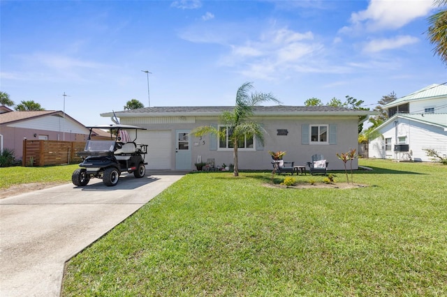 view of front facade featuring a front yard and a garage