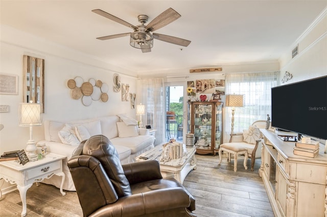 110 Ocean Hollow Ln Unit 101, Saint Augustine, FL 32084 - living area featuring ceiling fan, hardwood / wood-style flooring, and ornamental molding