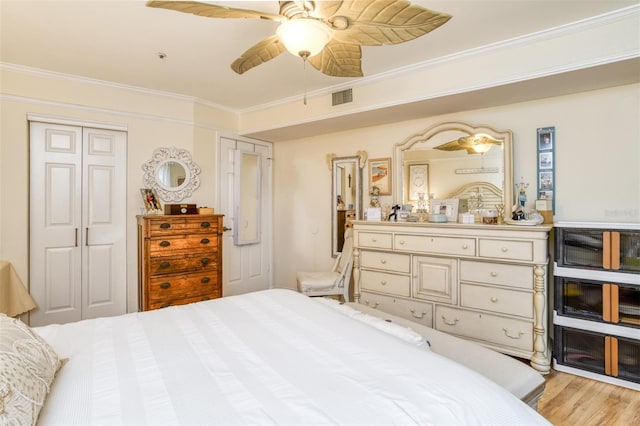 bedroom with ornamental molding, wood-type flooring, ceiling fan, and heating unit