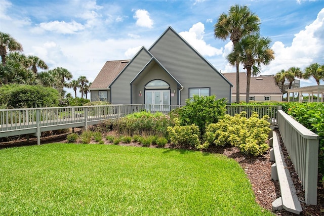 110 Ocean Hollow Ln Unit 101, Saint Augustine, FL 32084 - rear view of house with french doors