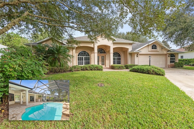 view of front of property featuring a front lawn and a garage