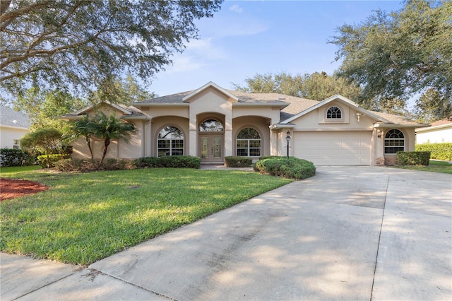 view of front facade featuring a front lawn and a garage