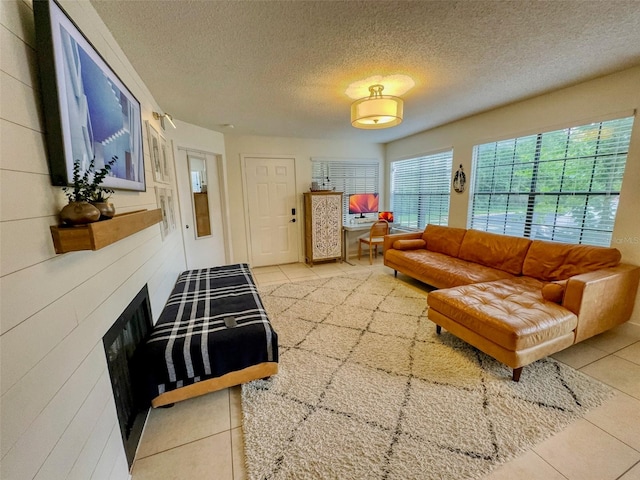 tiled living room with a textured ceiling