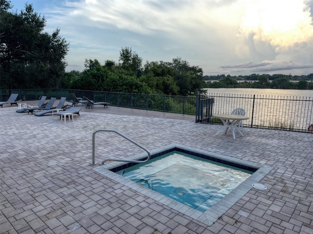 view of pool with a community hot tub and a patio area