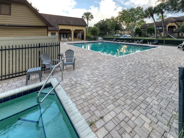 view of pool featuring a patio area