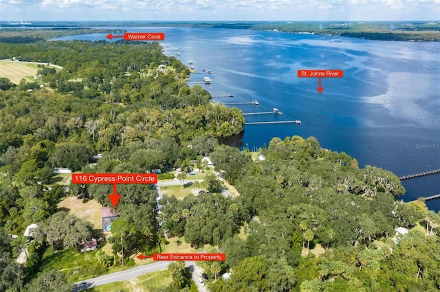 birds eye view of property with a water view