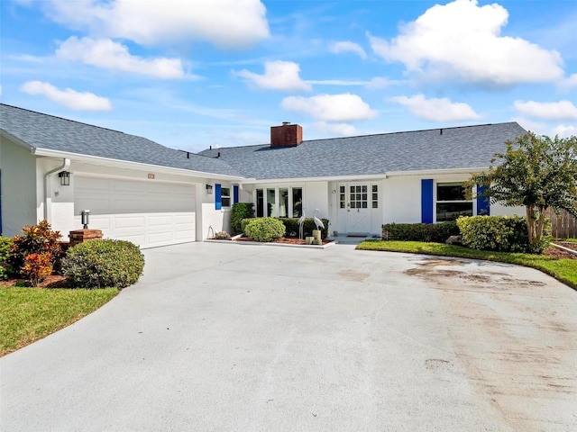 ranch-style home with a garage