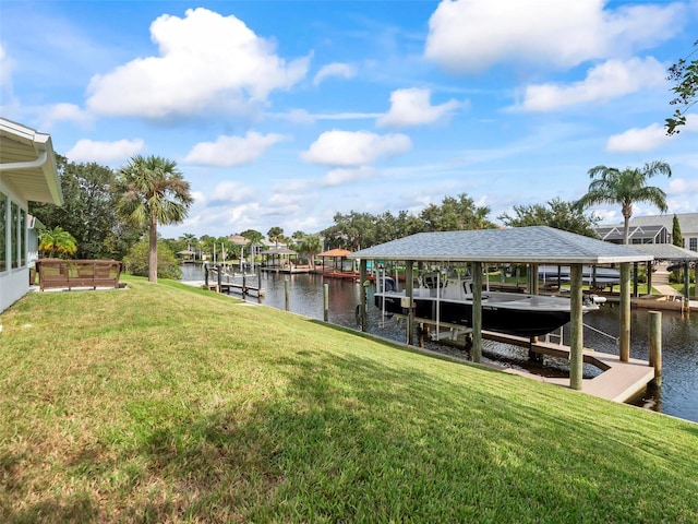 view of dock featuring a yard and a water view