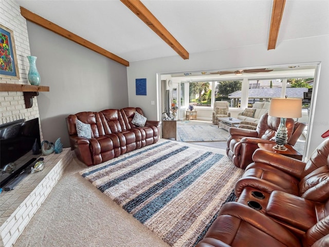 carpeted living room with a brick fireplace, beamed ceiling, and a healthy amount of sunlight