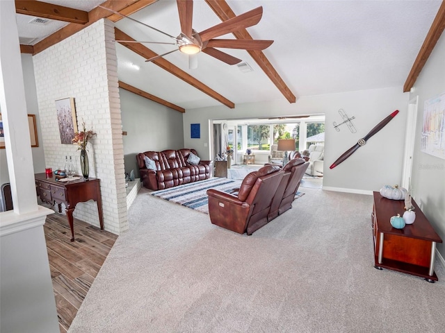 living room featuring ceiling fan, vaulted ceiling with beams, and light wood-type flooring