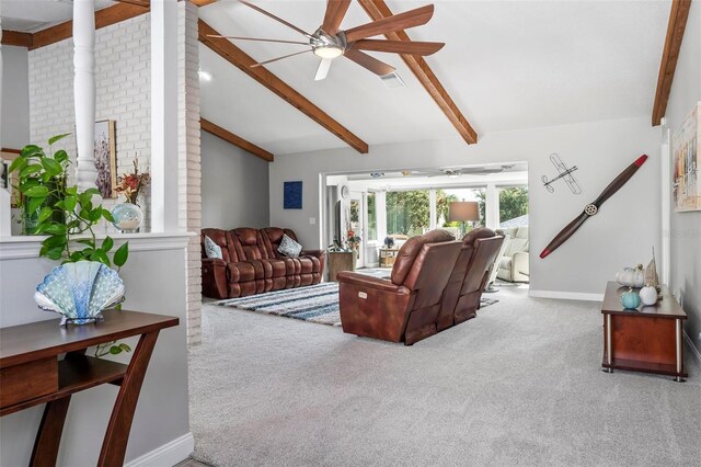 carpeted living room featuring ceiling fan and vaulted ceiling with beams