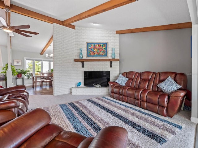 living room featuring a brick fireplace, lofted ceiling with beams, carpet flooring, and ceiling fan