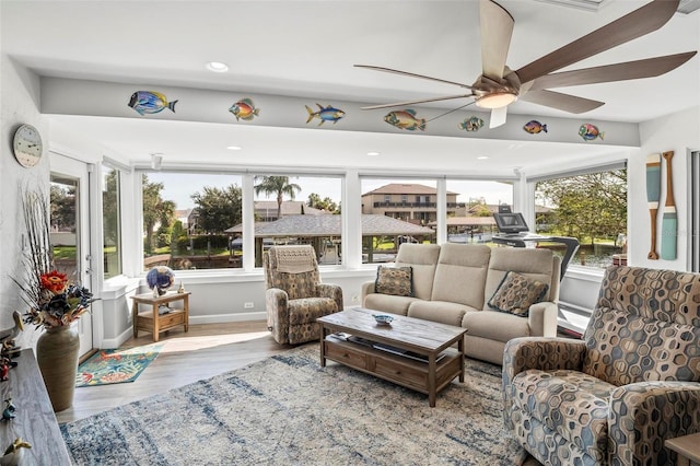 sunroom / solarium with ceiling fan