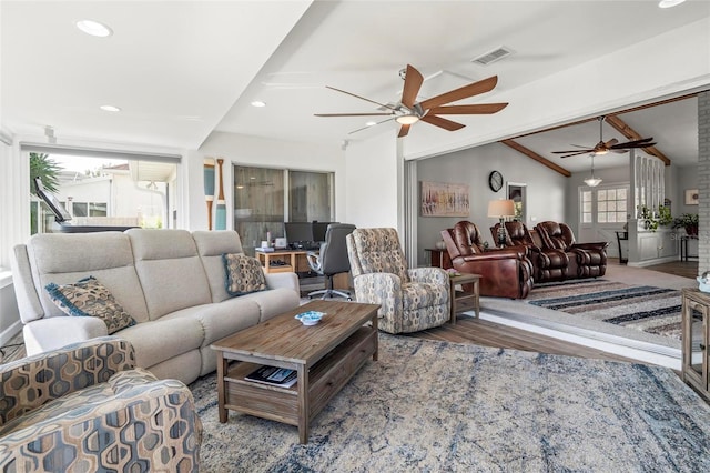 living room with lofted ceiling with beams, hardwood / wood-style floors, and ceiling fan