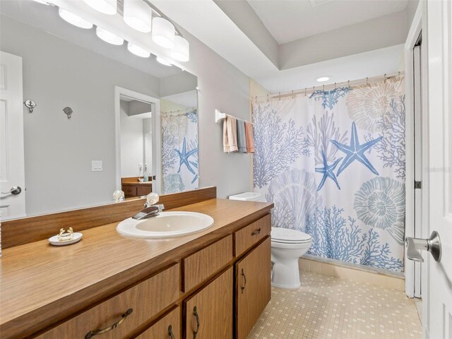 bathroom featuring tile patterned flooring, vanity, toilet, and a shower with curtain