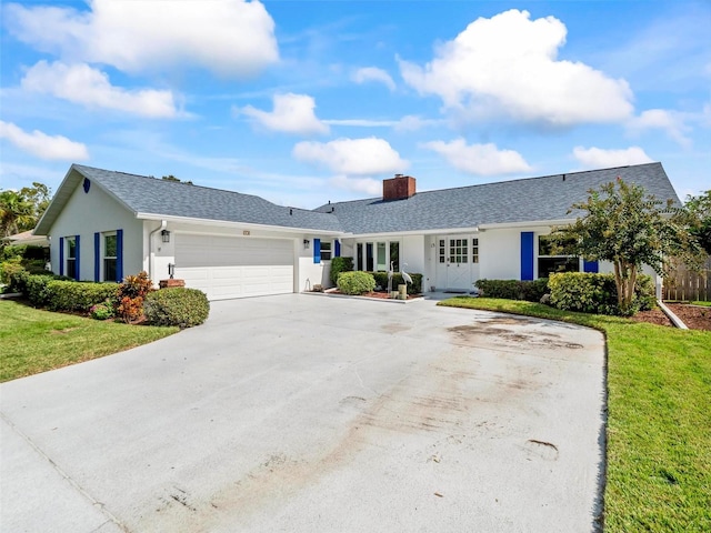 single story home with a front lawn and a garage