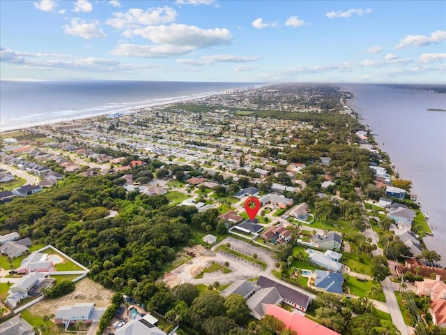 aerial view featuring a water view and a beach view