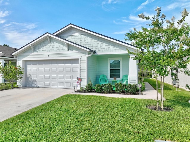 view of front of property featuring a garage and a front lawn