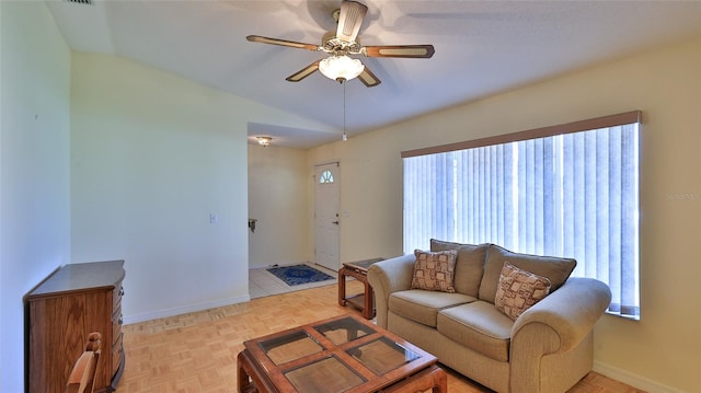 living room featuring light parquet flooring, vaulted ceiling, and ceiling fan