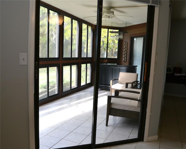 sunroom / solarium with plenty of natural light and ceiling fan