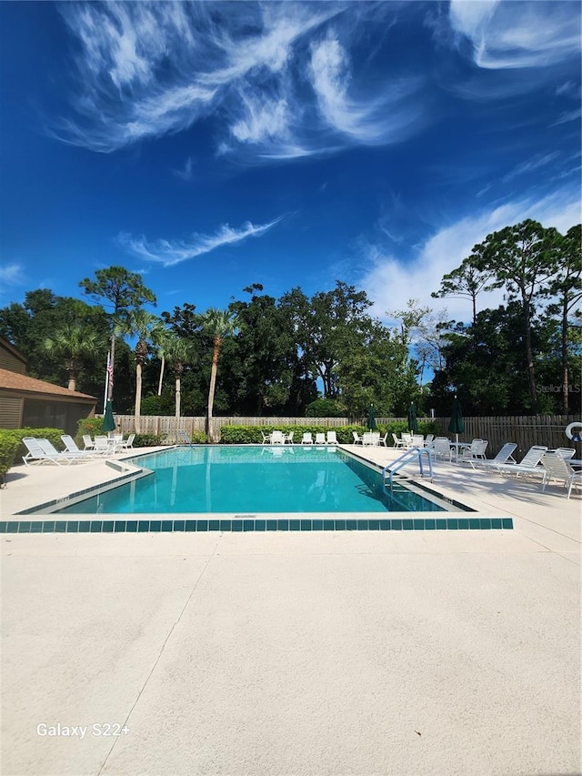 view of pool featuring a patio area