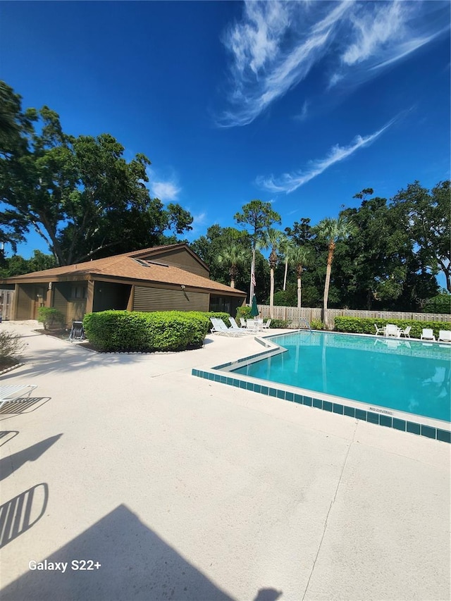 view of swimming pool featuring a patio