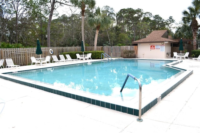 view of swimming pool with a patio