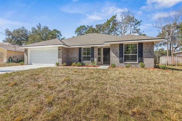 ranch-style home with a garage and a front yard