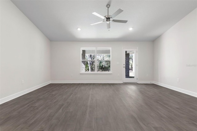 unfurnished room with ceiling fan, lofted ceiling, and dark hardwood / wood-style flooring