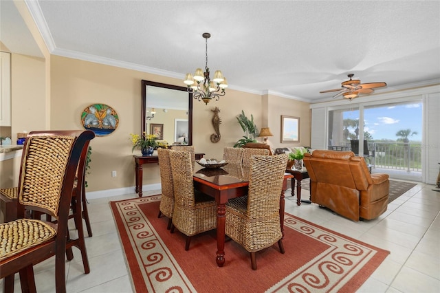 tiled dining area with a textured ceiling, ceiling fan with notable chandelier, and ornamental molding