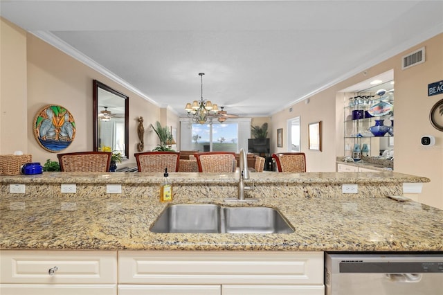 kitchen featuring dishwasher, light stone counters, sink, hanging light fixtures, and crown molding