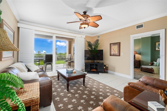 living room featuring ceiling fan, light tile patterned floors, and ornamental molding