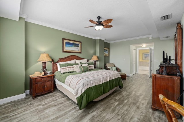 bedroom featuring wood-type flooring, a textured ceiling, connected bathroom, crown molding, and ceiling fan