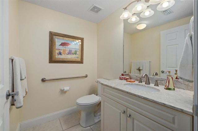 bathroom featuring tile patterned floors, vanity, and toilet