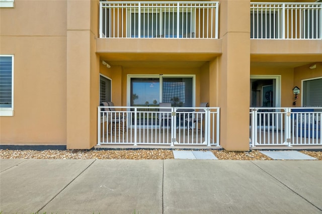 property entrance with a balcony