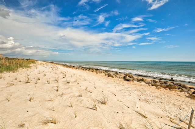 property view of water featuring a beach view