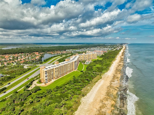 birds eye view of property with a view of the beach and a water view