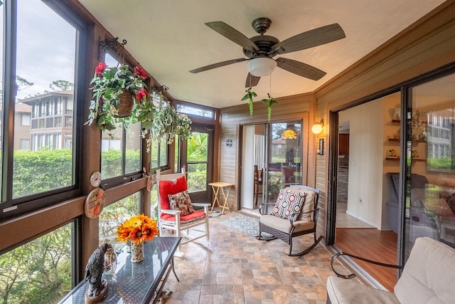 sunroom featuring a wealth of natural light and ceiling fan