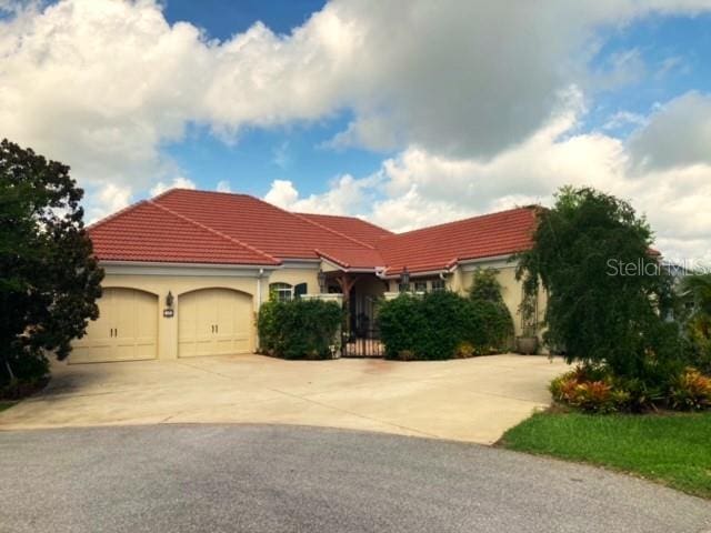 mediterranean / spanish-style house featuring a garage