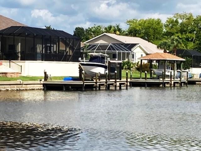 dock area featuring a water view and a lanai