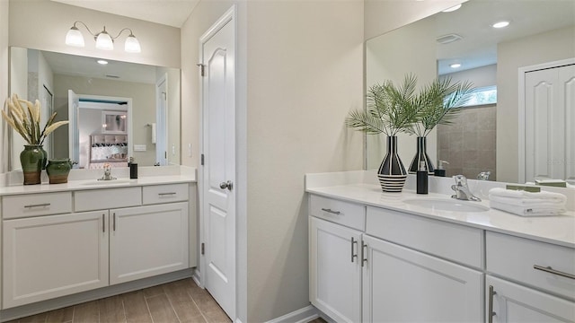 bathroom featuring hardwood / wood-style floors and vanity