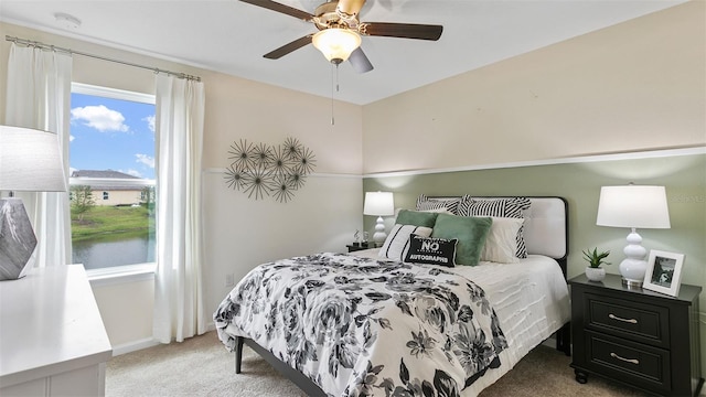 bedroom with ceiling fan and light colored carpet