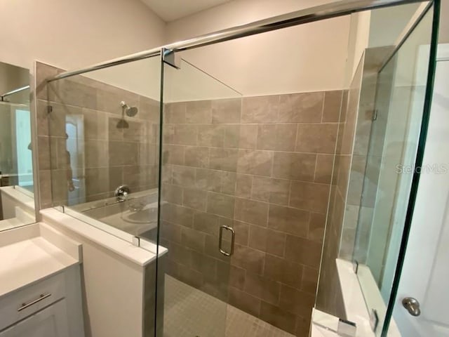 bathroom with vanity and an enclosed shower