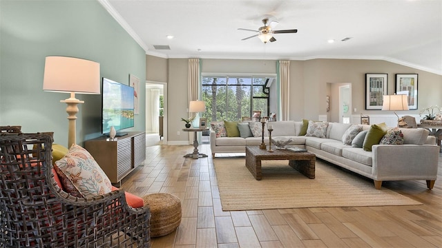 living room featuring wood-type flooring, ornamental molding, and ceiling fan