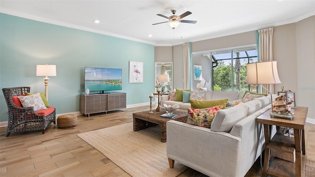 living room featuring light wood-type flooring, ornamental molding, and ceiling fan