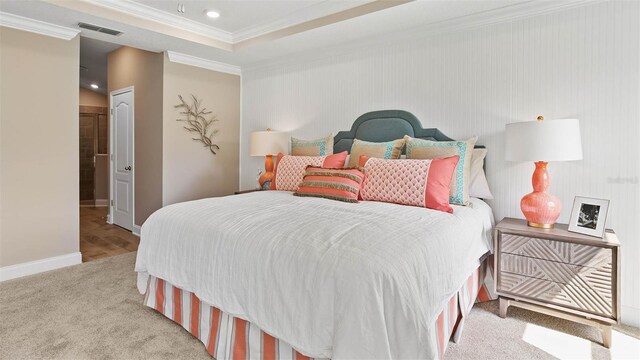 bedroom featuring light carpet, a closet, and crown molding