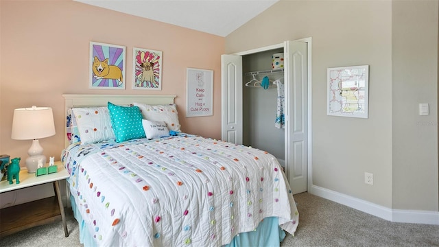 bedroom with vaulted ceiling, light colored carpet, and a closet