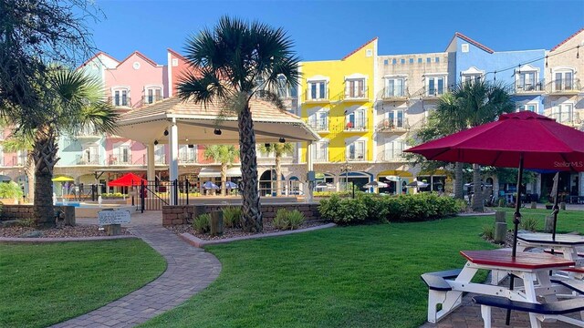 view of property's community with a gazebo and a yard